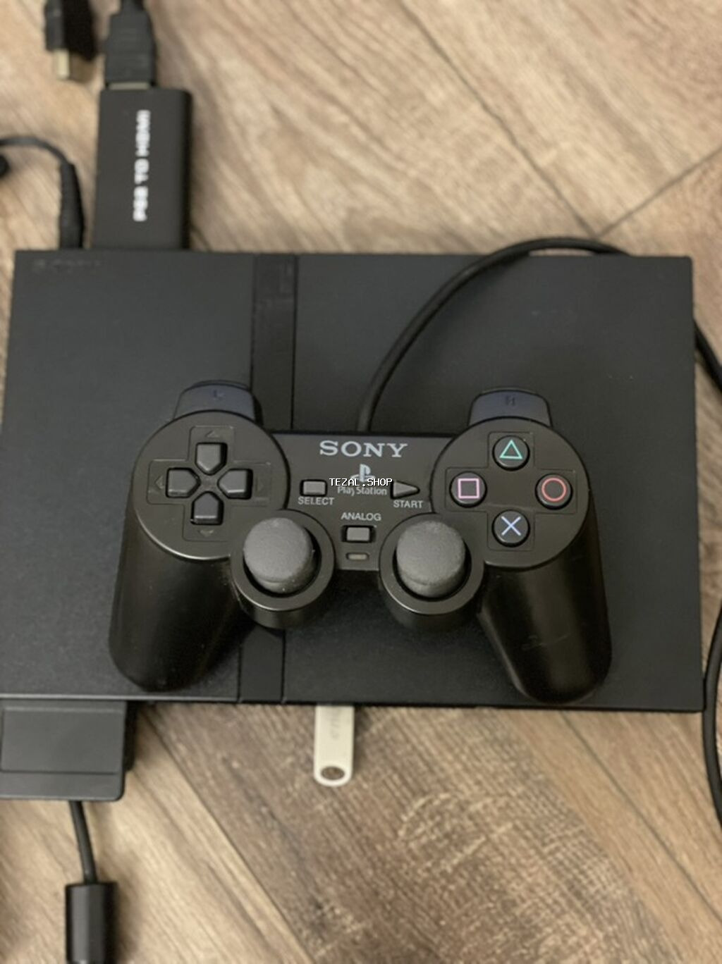 Sony PlayStation 2 Slim (SCPH seriyası) oyun konsolu Paket tərkibi: -